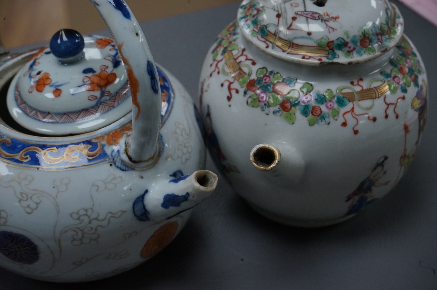 A Chinese famille rose ‘boys and ladies’ teapot, Qianlong period and a Japanese Arita sake pot or ewer, early 18th century, tallest 16cm high.